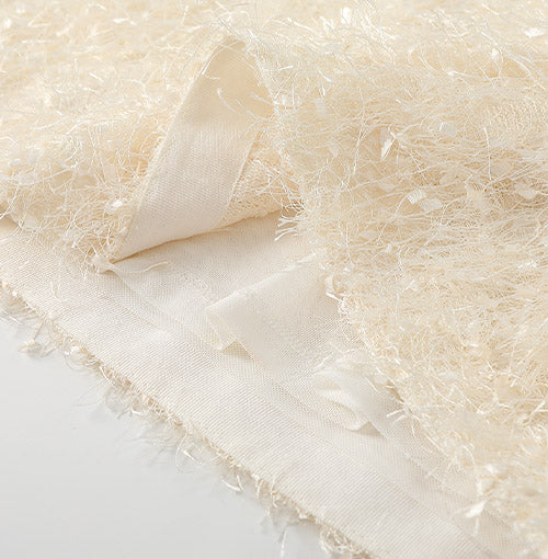 Natural Fringed Finish detail on the Ivory Fringe Glow Dress