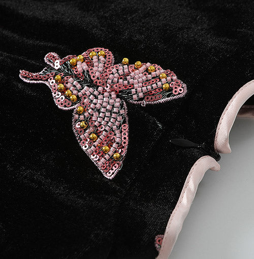 Beaded butterfly applique and blush sleeve detail