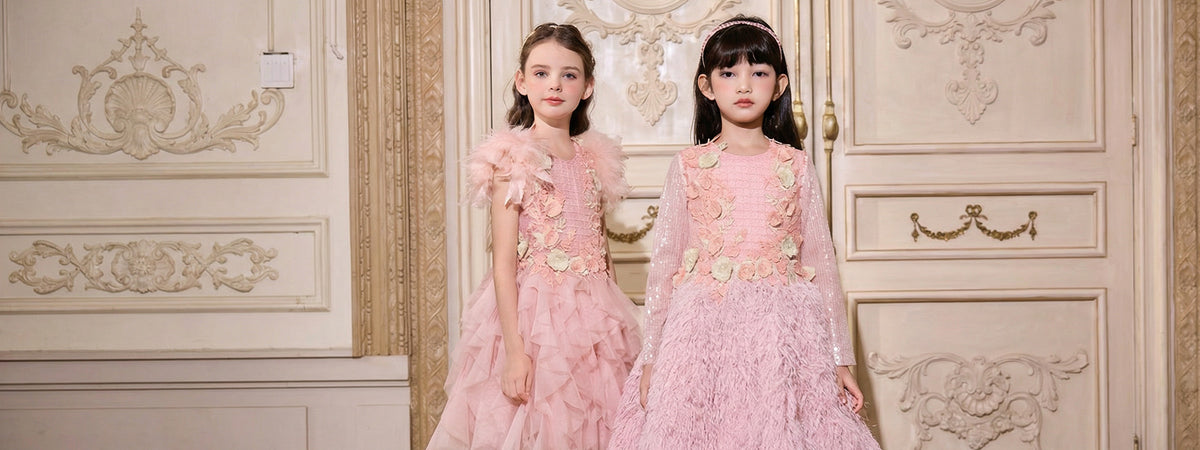 Two girls in elegant pink occasion dresses by I Natural Angel