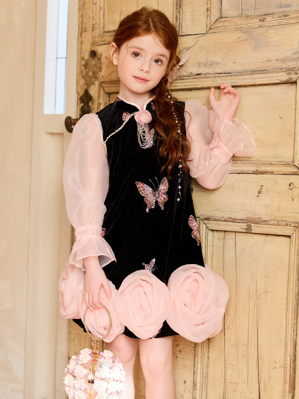 Girl wearing the Black Velvet Butterfly Rose Dress