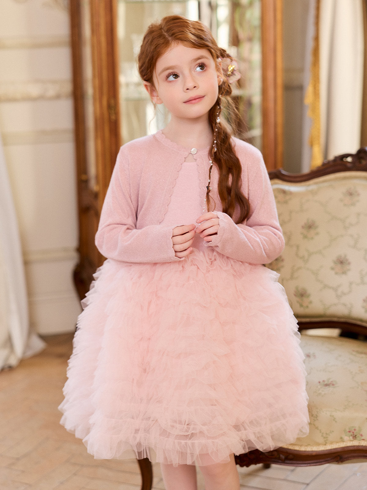 Model view showing the blush dress bodice and full layered skirt