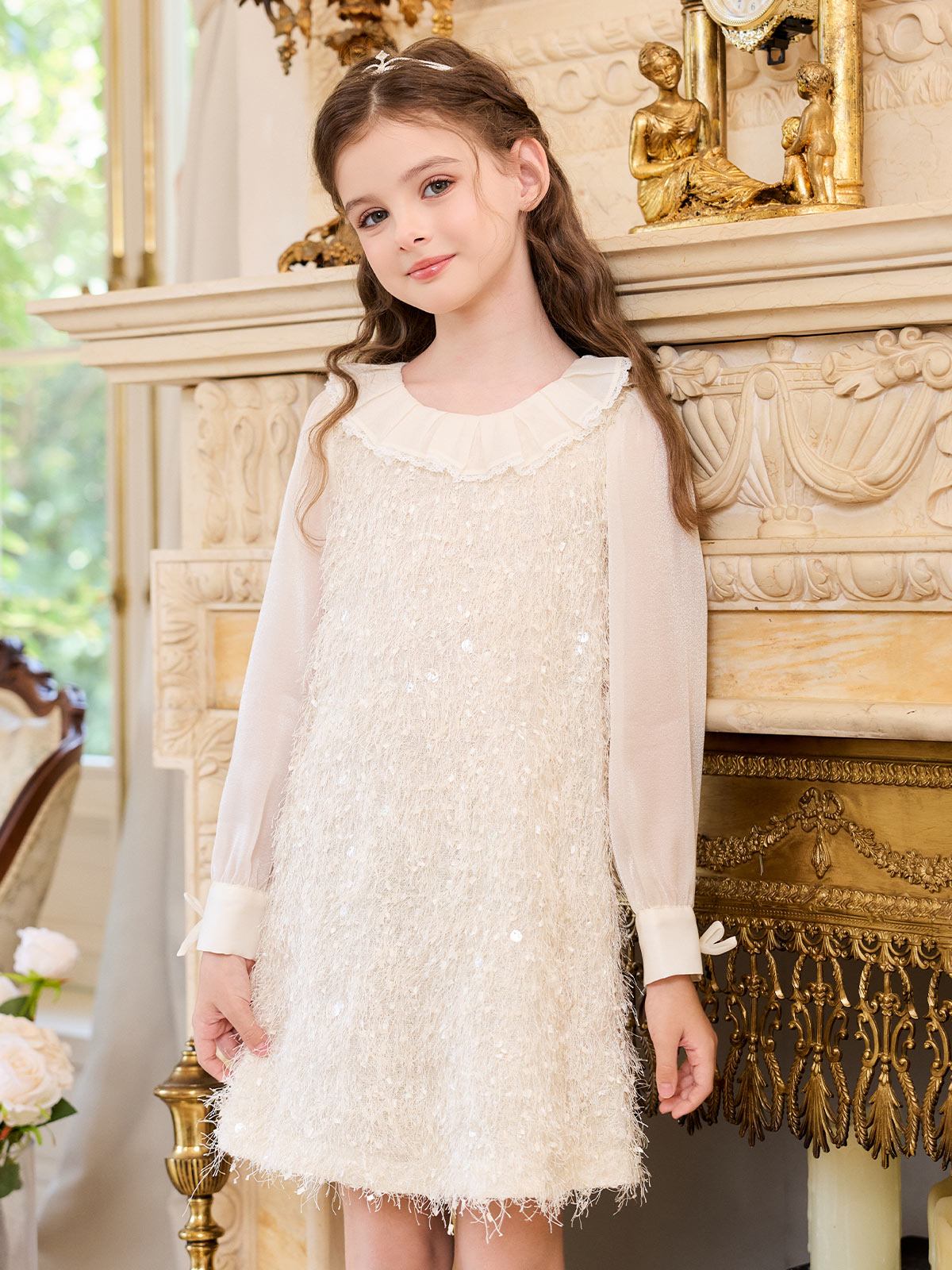 Seated model view of the Ivory Fringe Glow Dress