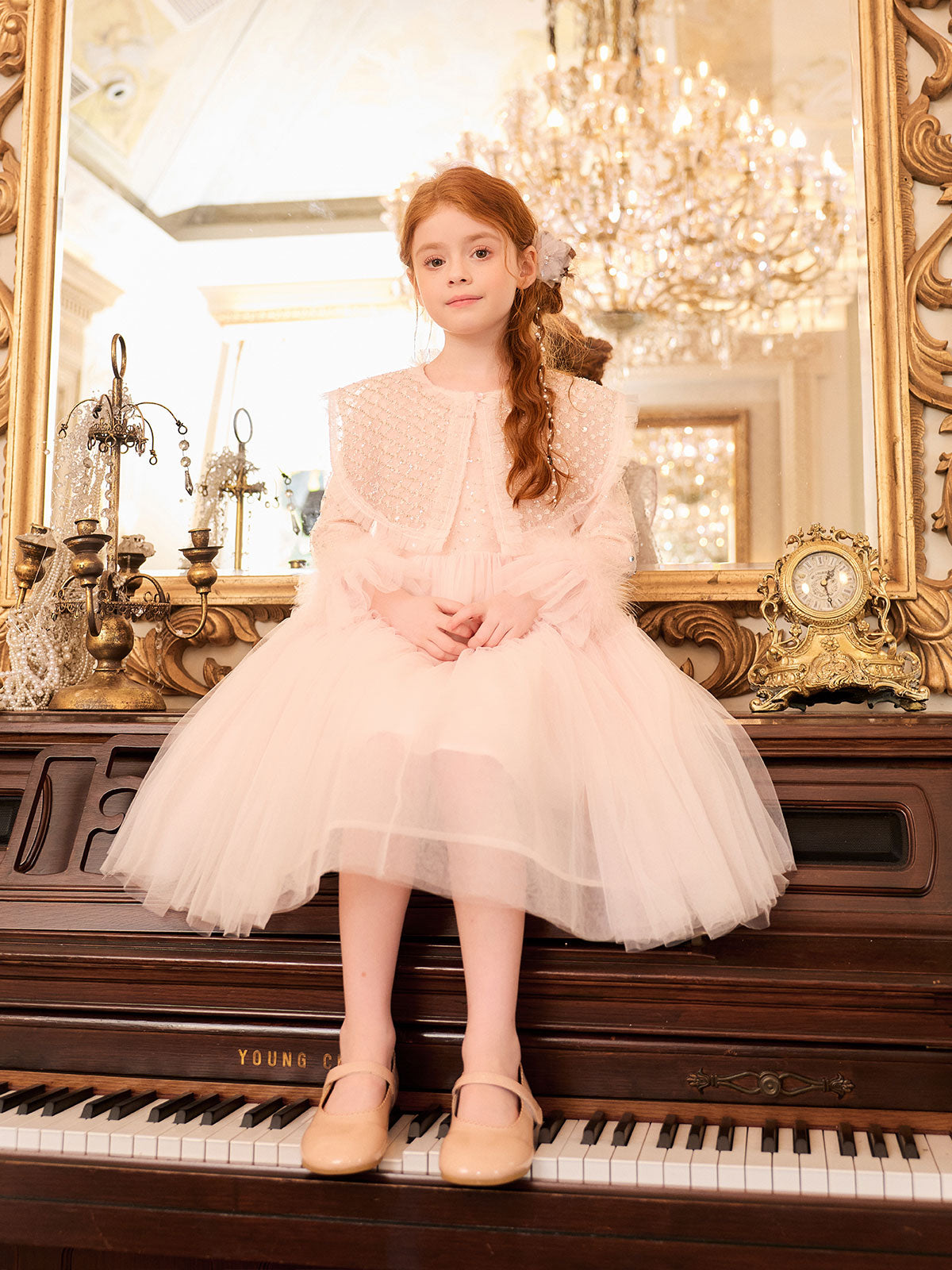 Side styling view of the Blush Sequin Cape Tulle Dress