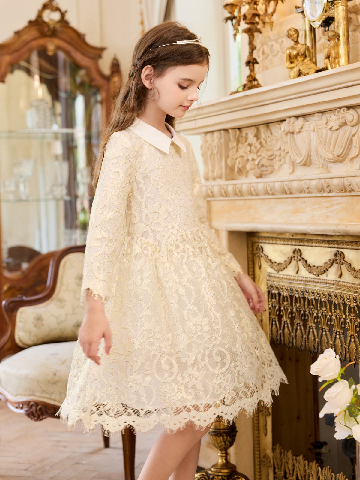 Seated model view of the Ivory Gilt Lace Collar Dress