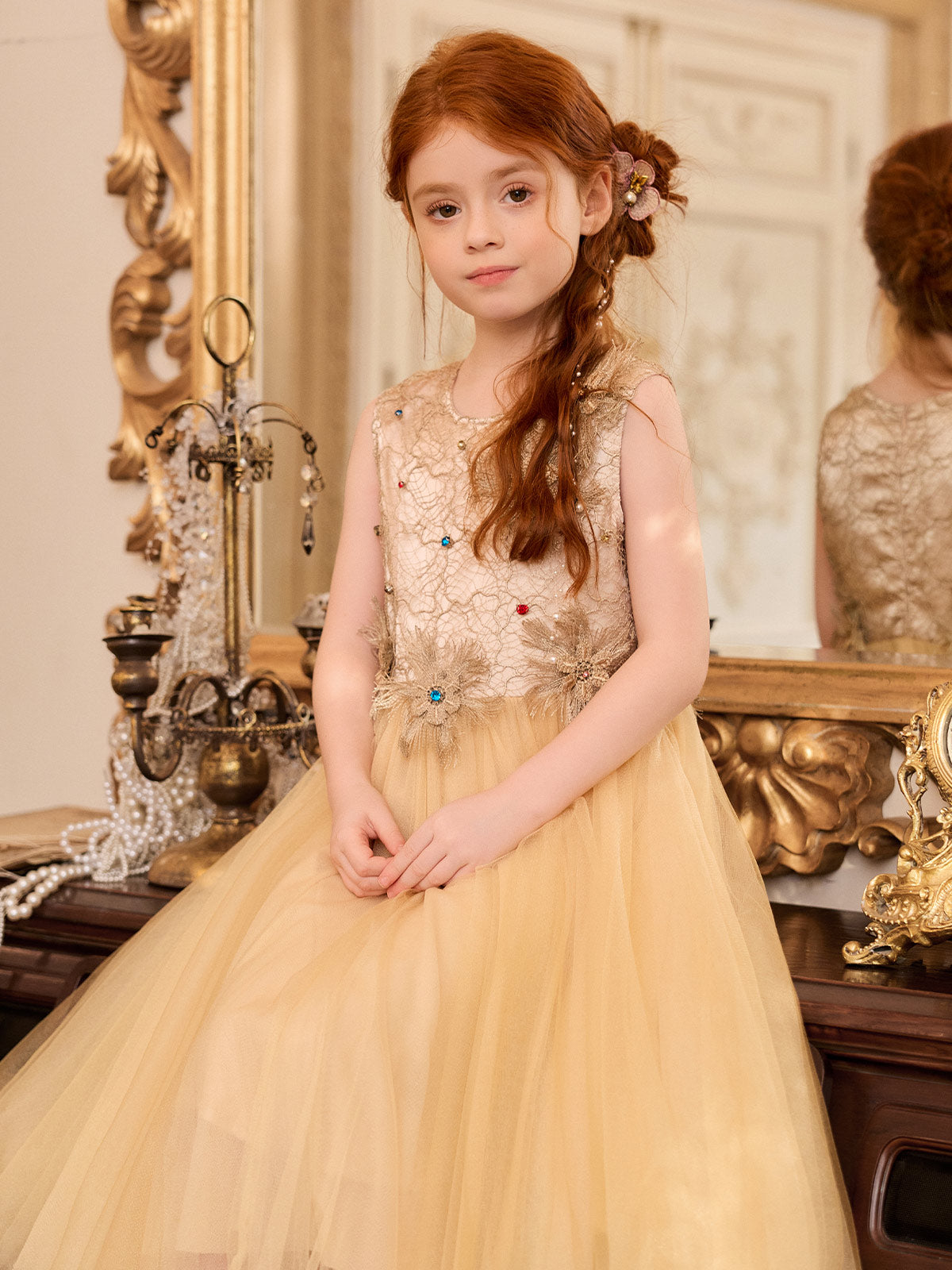 Close model view of the champagne embroidered dress bodice