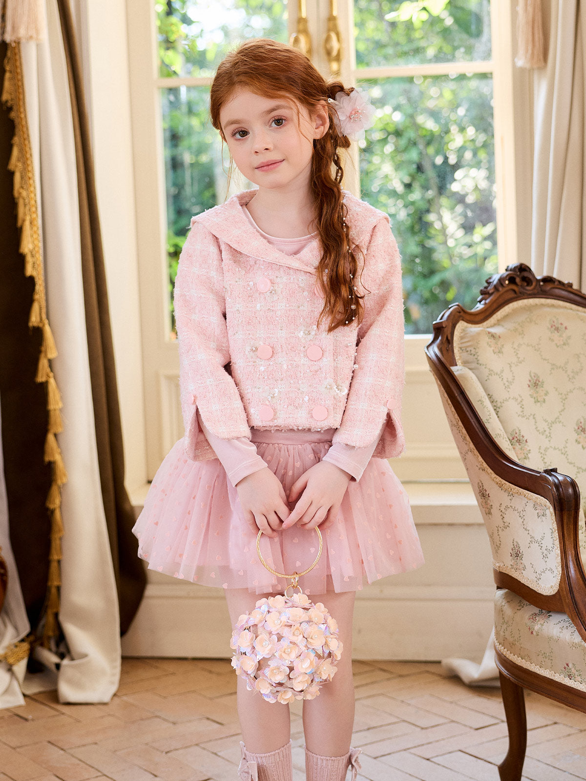 Full-length styling view of the blush velvet heart dress with a pink jacket