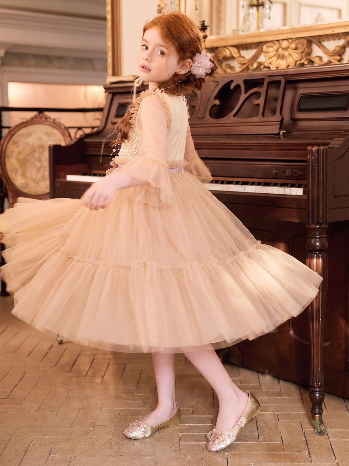 Side movement view of the Apricot Pearl Convertible Tulle Dress
