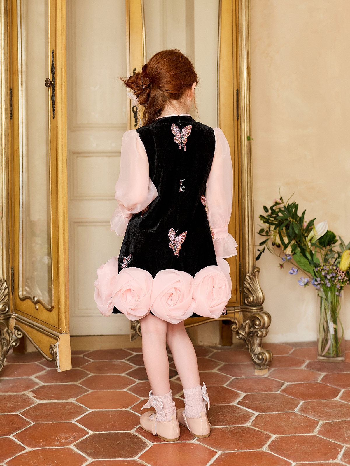 Back view of the Black Velvet Butterfly Rose Dress