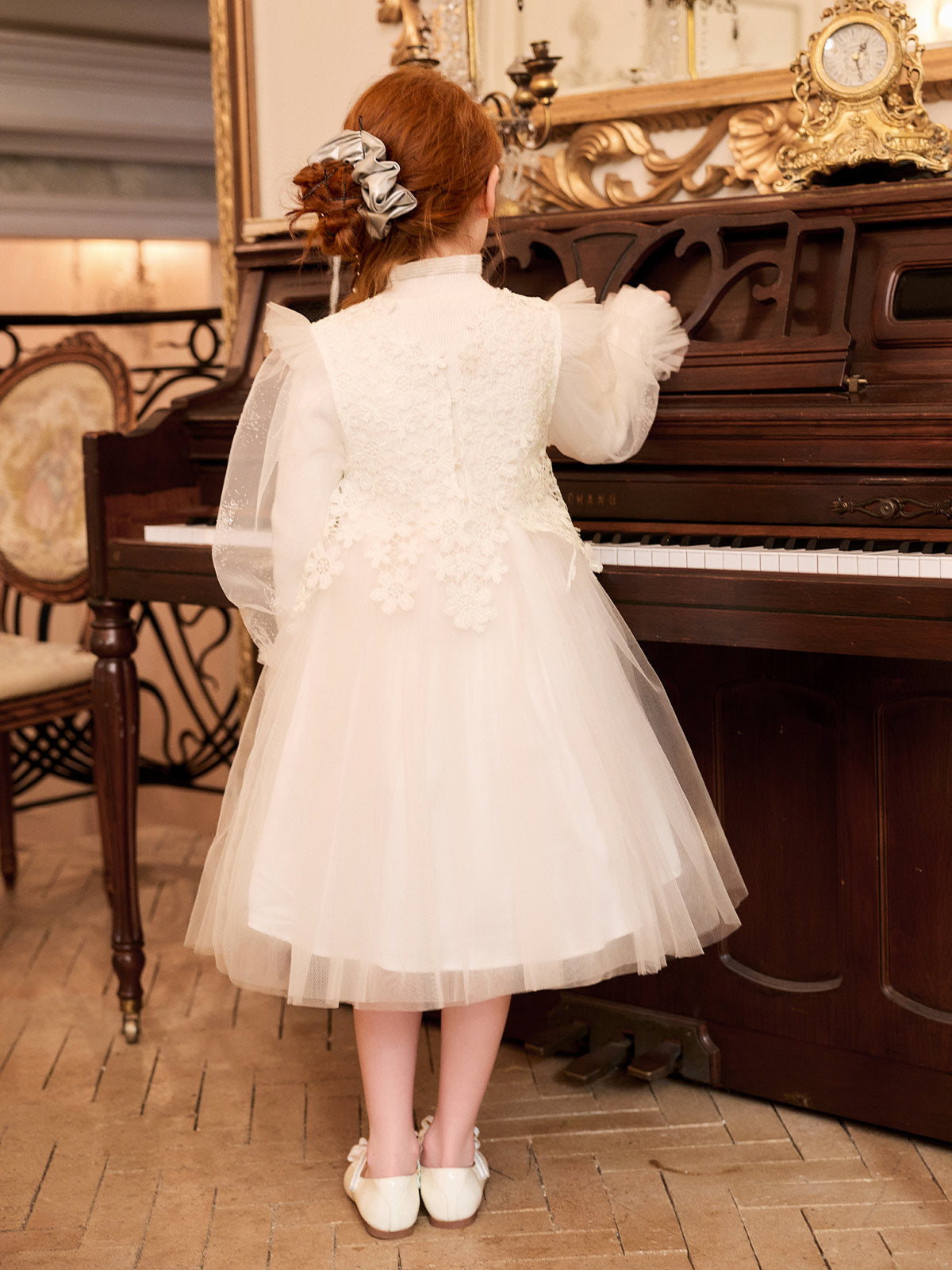 Back model view of the ivory lace knit and tulle dress