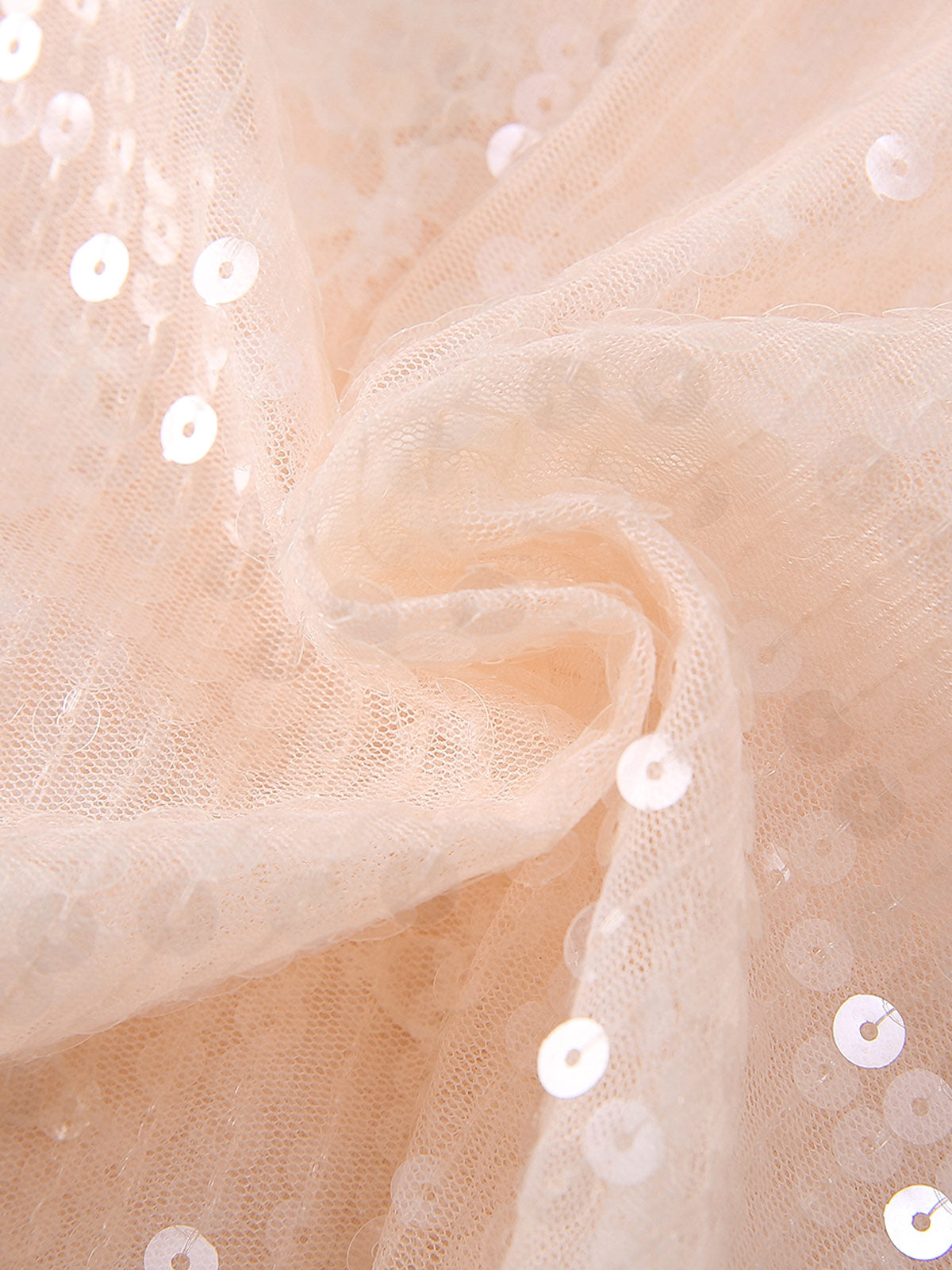 Sequins over rose lace on the Blush Sparkle Lotus Cape Dress