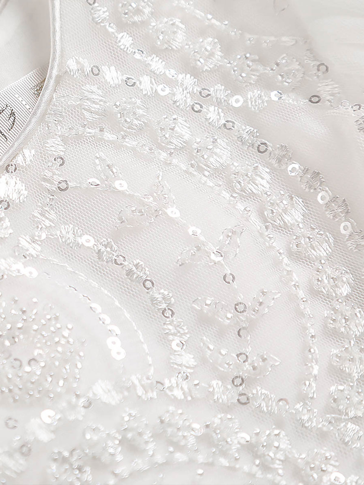 Close-up of tonal sequin embroidery on the Sparkle Tiers bodice