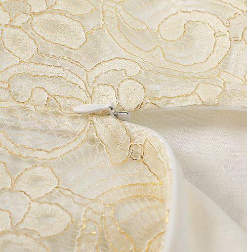 Interior finish and closure detail of the Ivory Gilt Lace Collar Dress