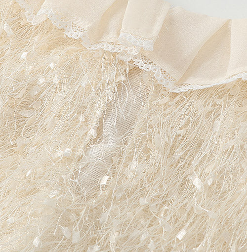 Interior finish and closure detail of the Ivory Fringe Glow Dress