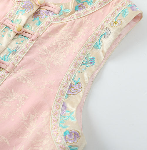 Embroidered armhole and bound edge detail