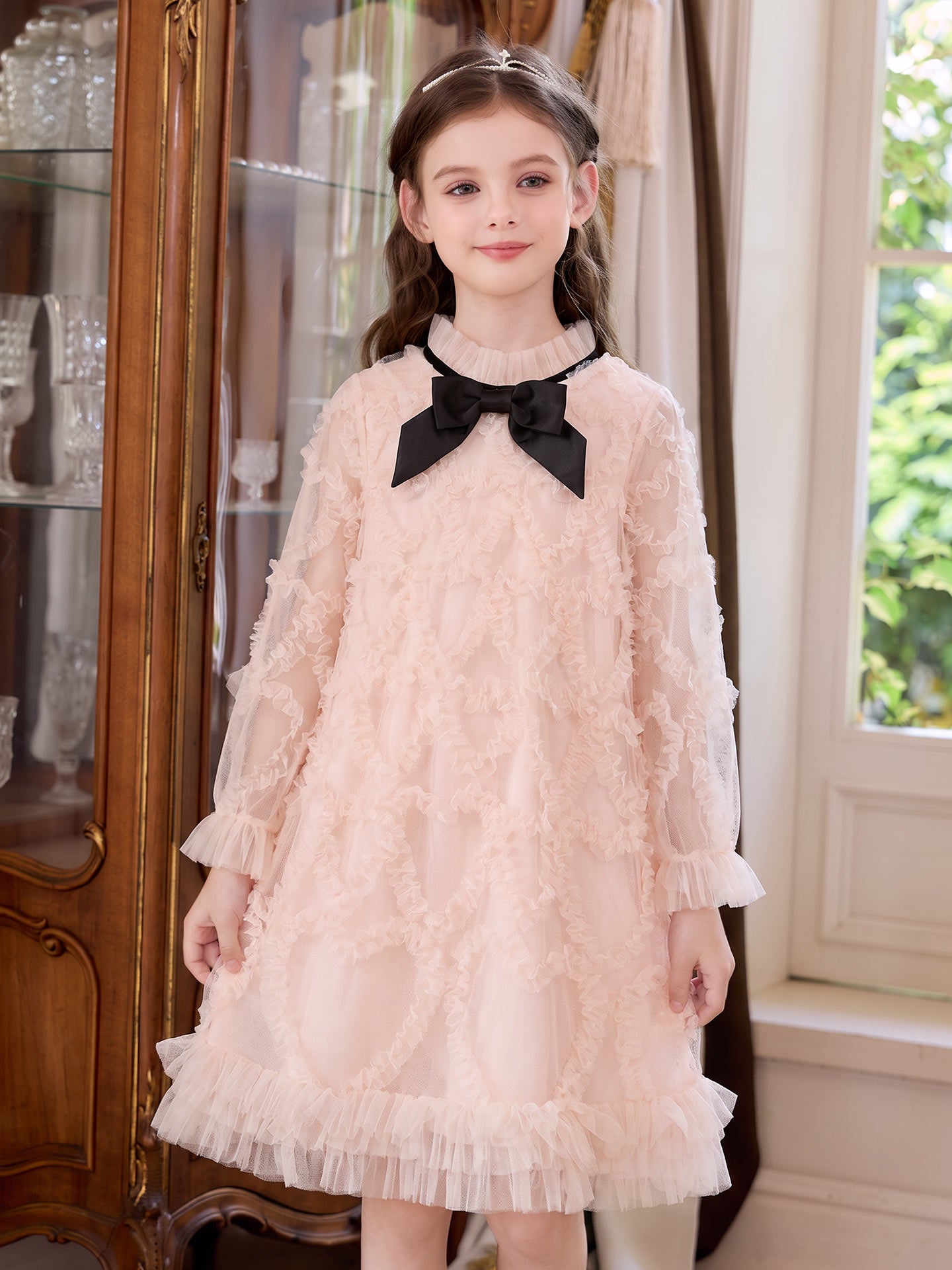 Girl wearing the Blush Velvet Bow Tulle Dress