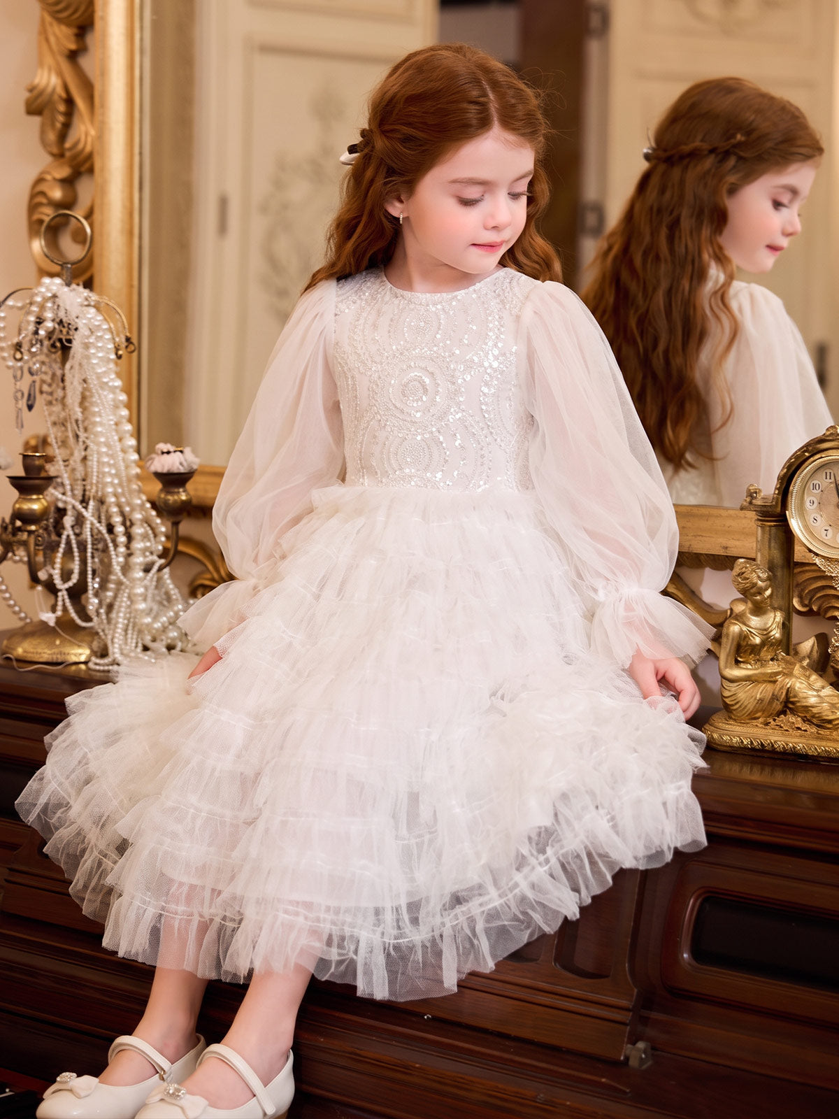 Girl wearing the Sparkle Tiers ivory sequin tulle dress