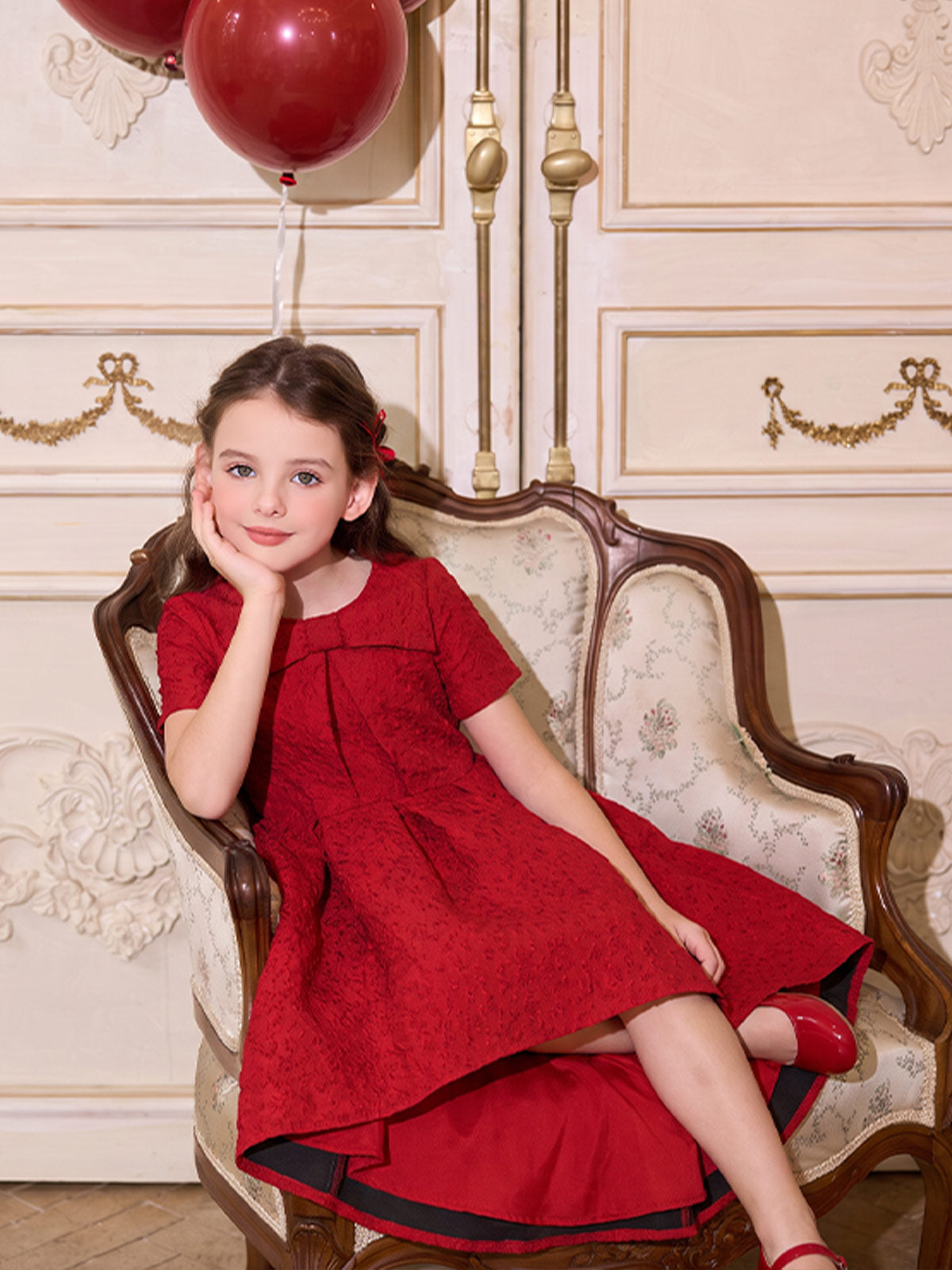 Seated view of the Scarlet Jacquard Bow High-Low Dress