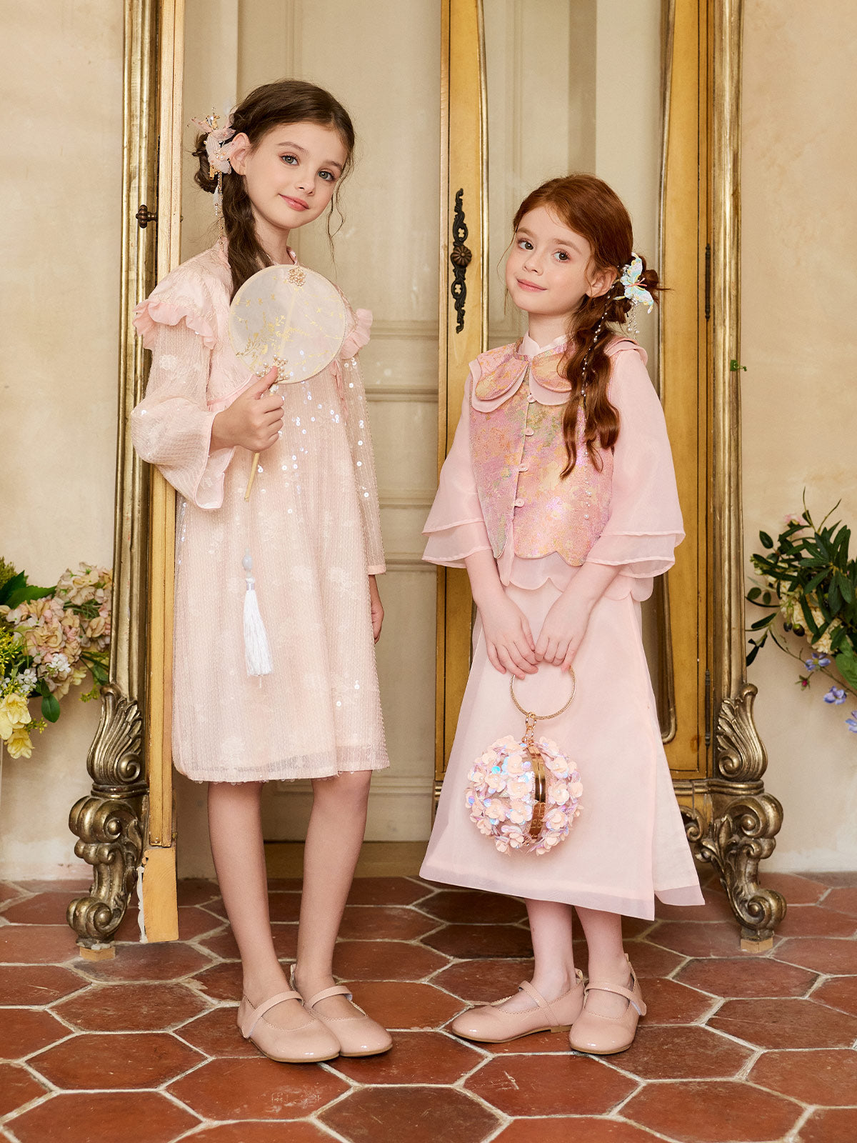 Front model view of the Blush Sparkle Lotus Cape Dress