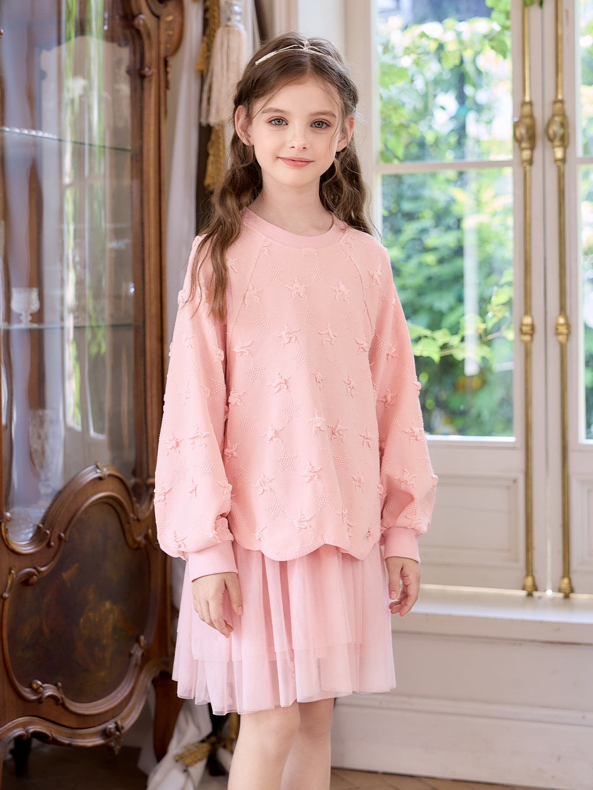 Seated model view of the Pink Star Tulle Layered Dress