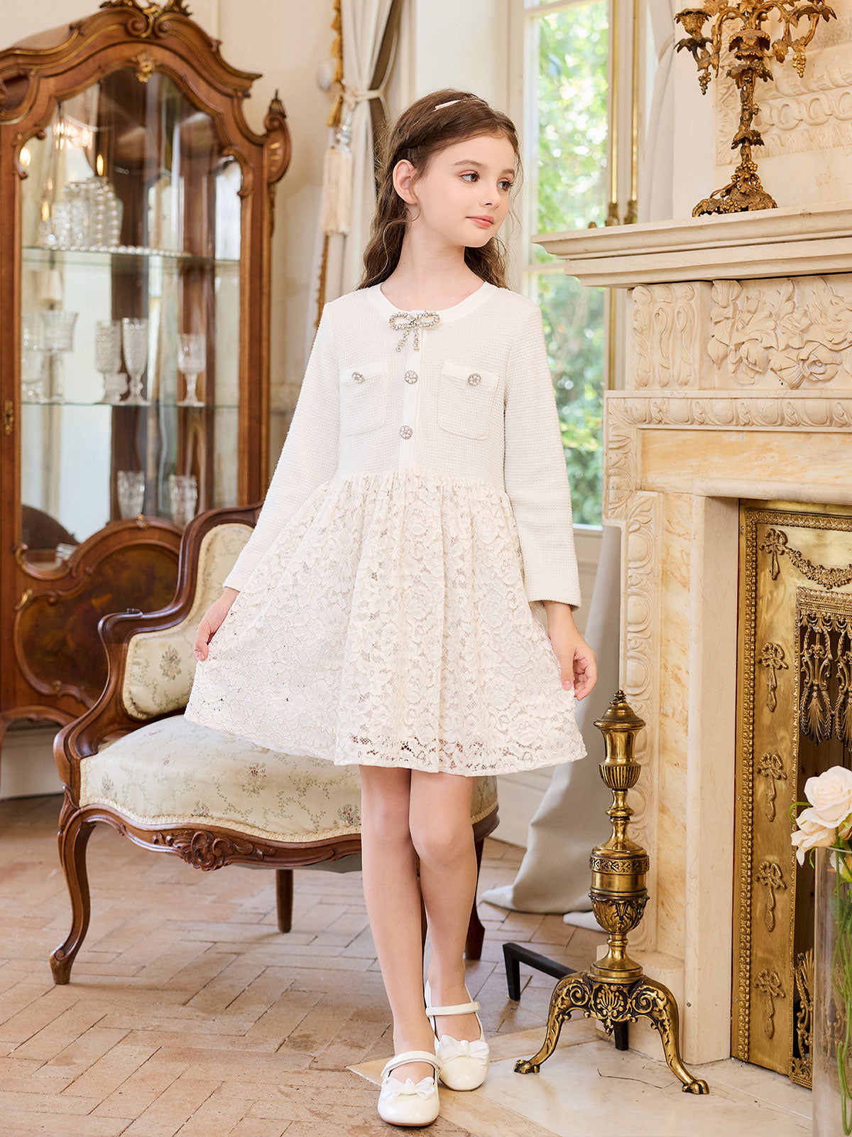 Side styling view of the Ivory Honeycomb Pearl Lace Dress