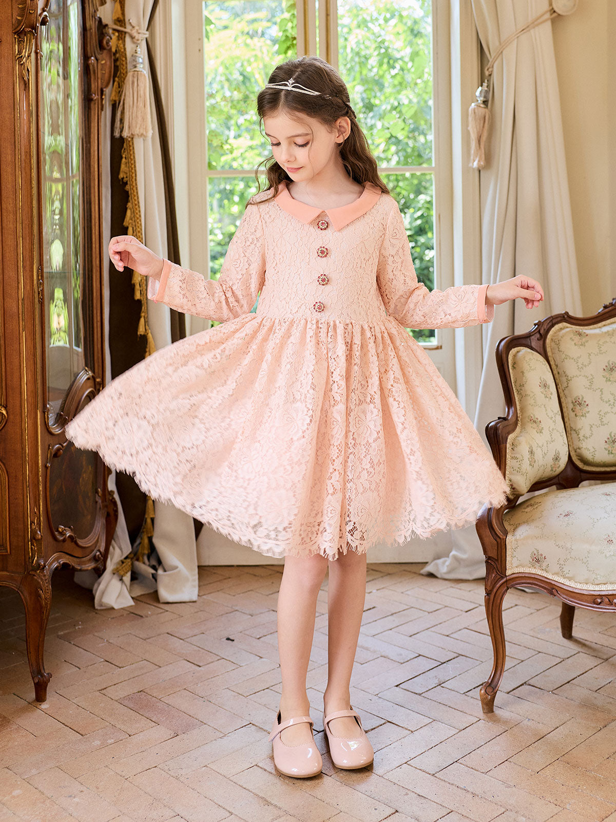 Side styling view of the Peach Petal Pearl Lace Dress