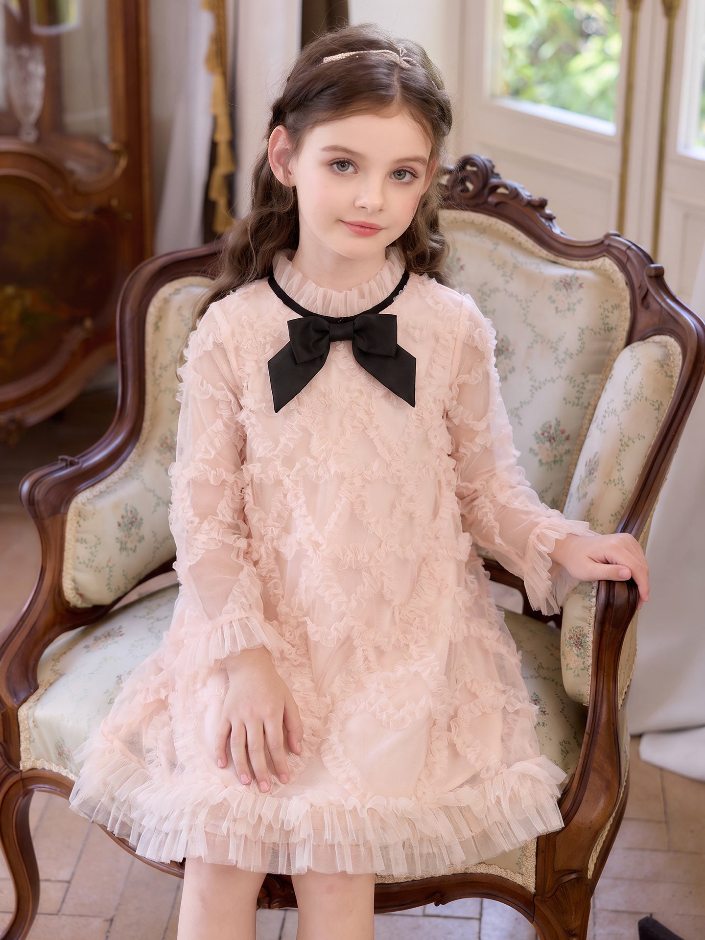 Seated model view of the Blush Velvet Bow Tulle Dress