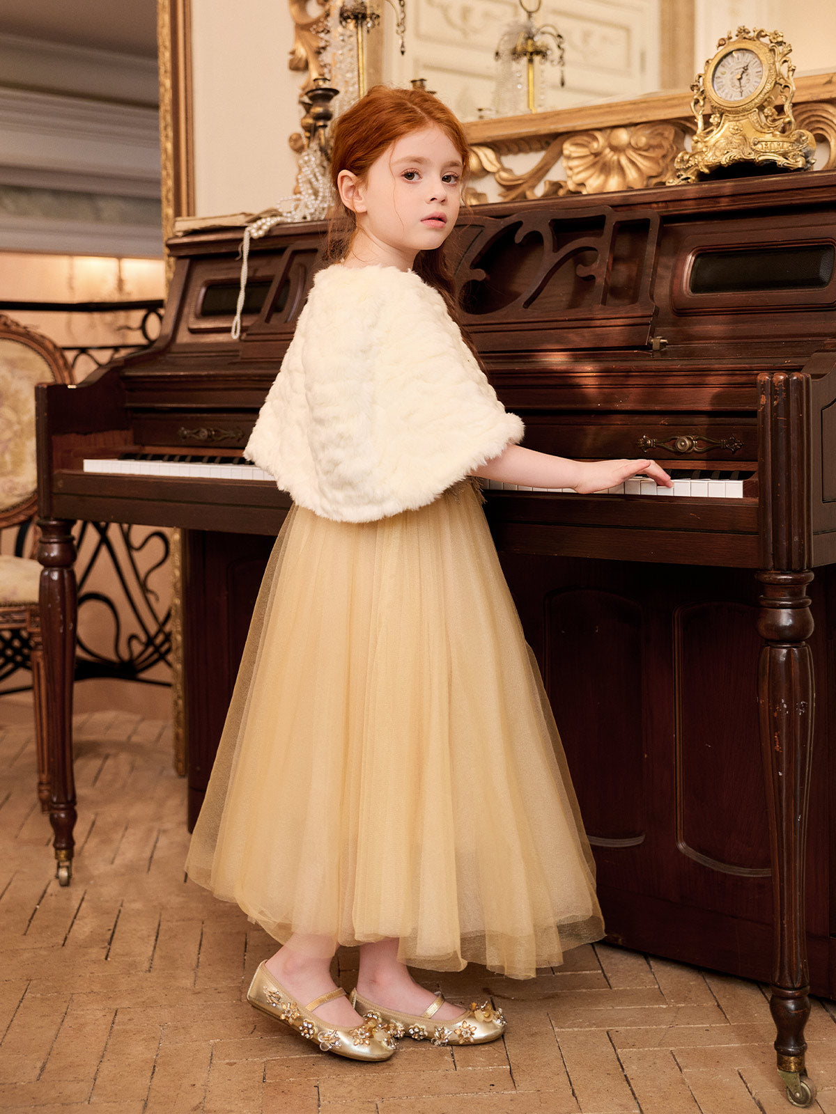 Back model view of the champagne dress with the included ivory cape