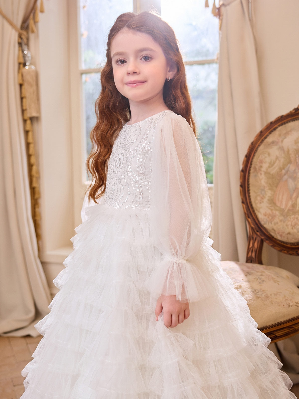 Side view of the Sparkle Tiers dress with sheer balloon sleeves