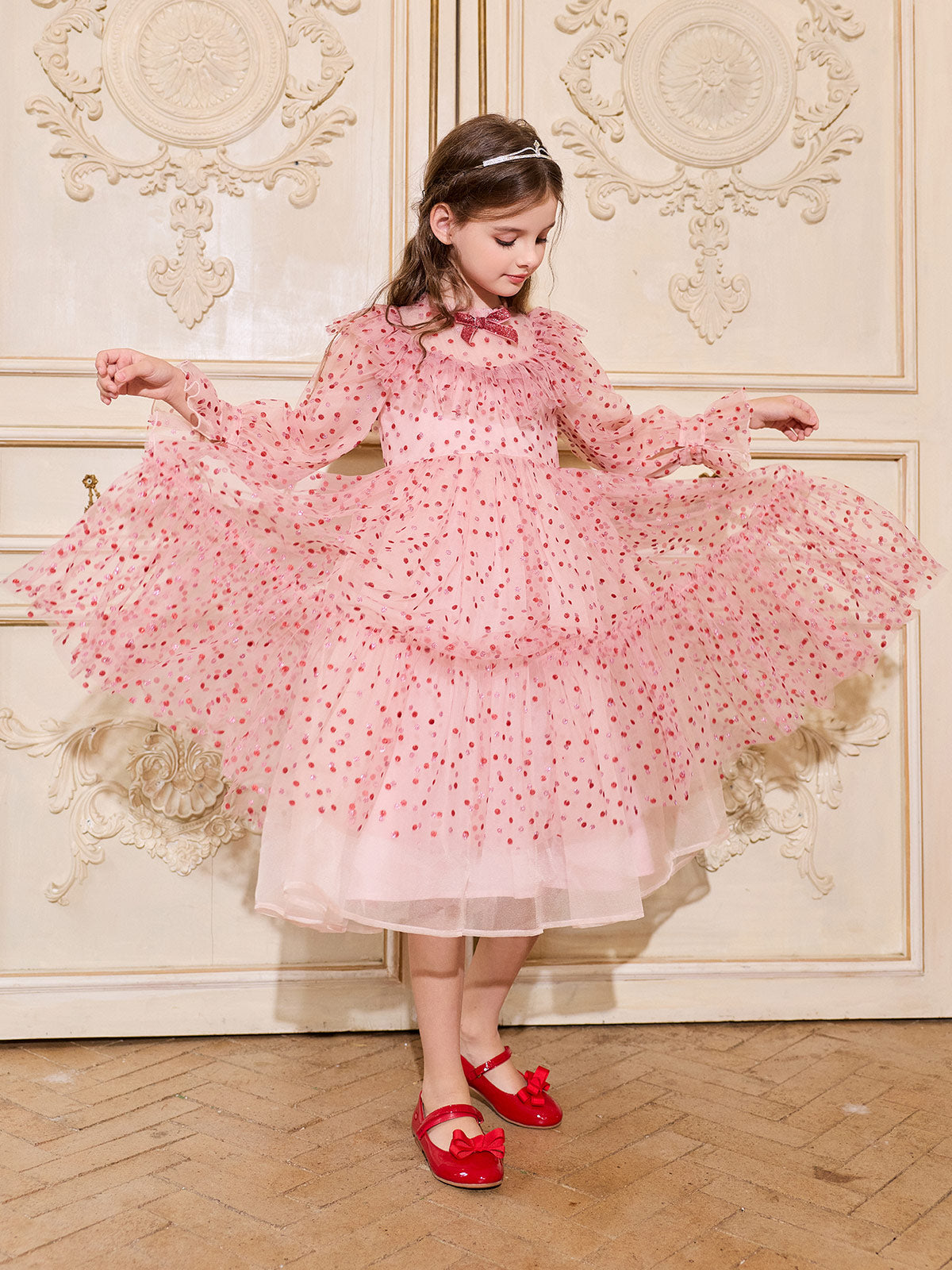 Girl twirling in the Blush Ruby Sparkle Tulle Dress
