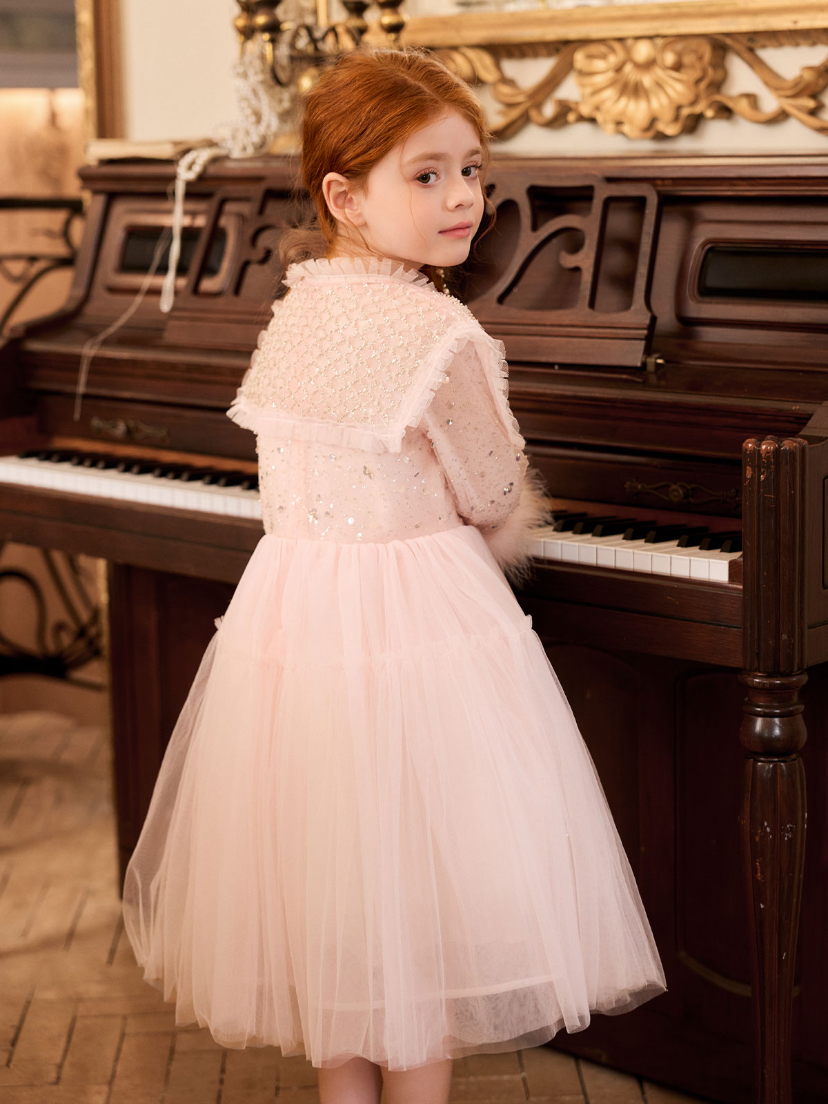 Occasion portrait featuring the Blush Sequin Cape Tulle Dress