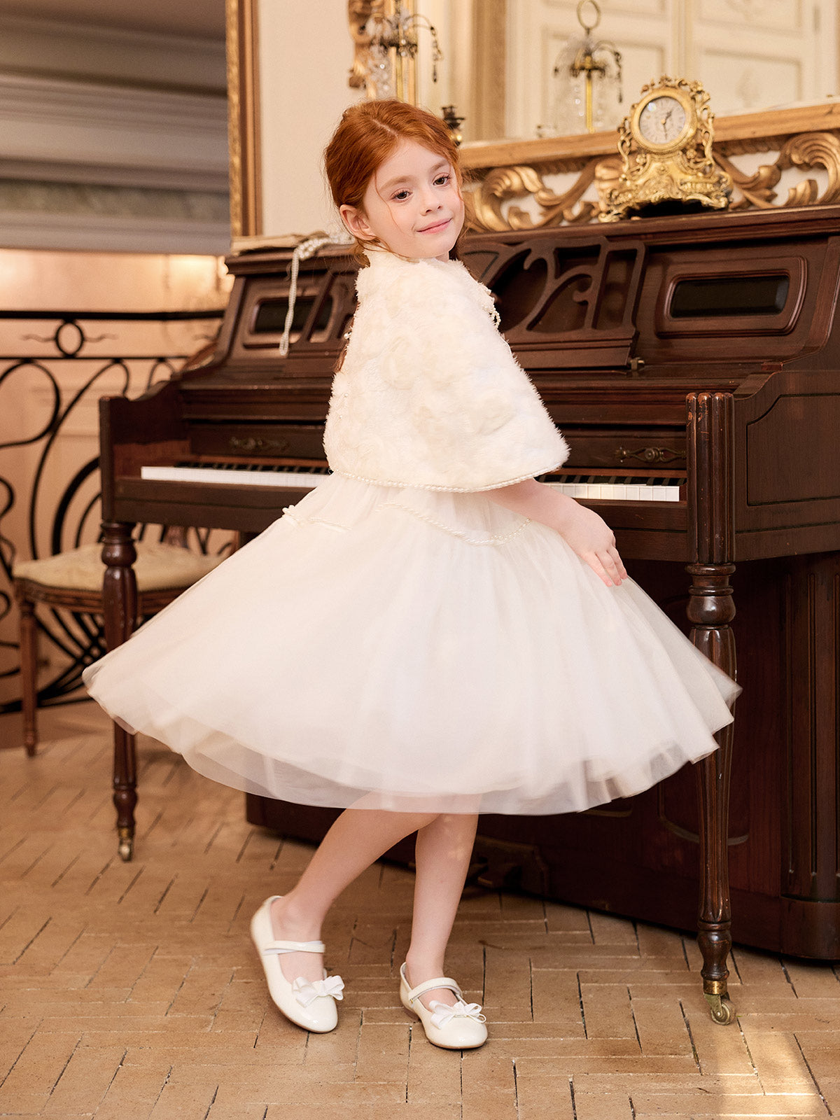 Side movement view of the Ivory Rose Pearl Cape Dress Set