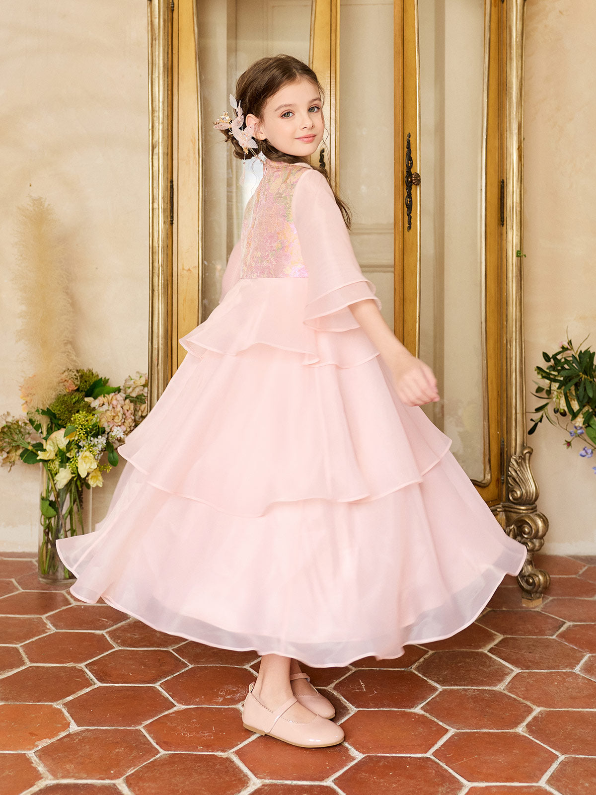 Back movement view of the Blush Blossom Tiered Organza Dress