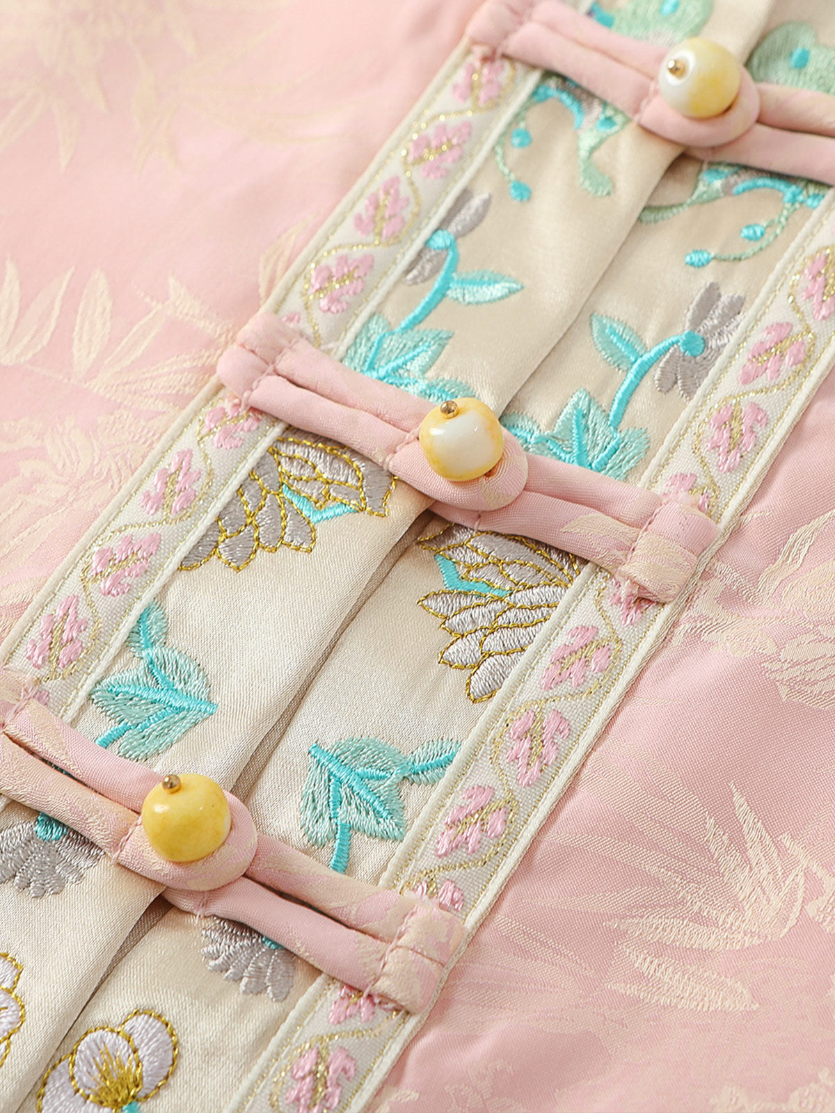 Botanical embroidered placket and jade-tone button detail