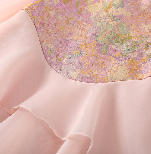 Curved brocade yoke and organza seam detail
